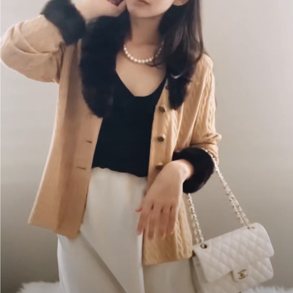 St. John sweater with faux fur sleeves and collar